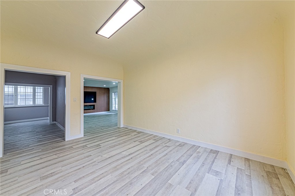 5355 West 8th Street Los Angeles, CA 90036 - Photo 26 of 32 wooden floor in an empty room with a window