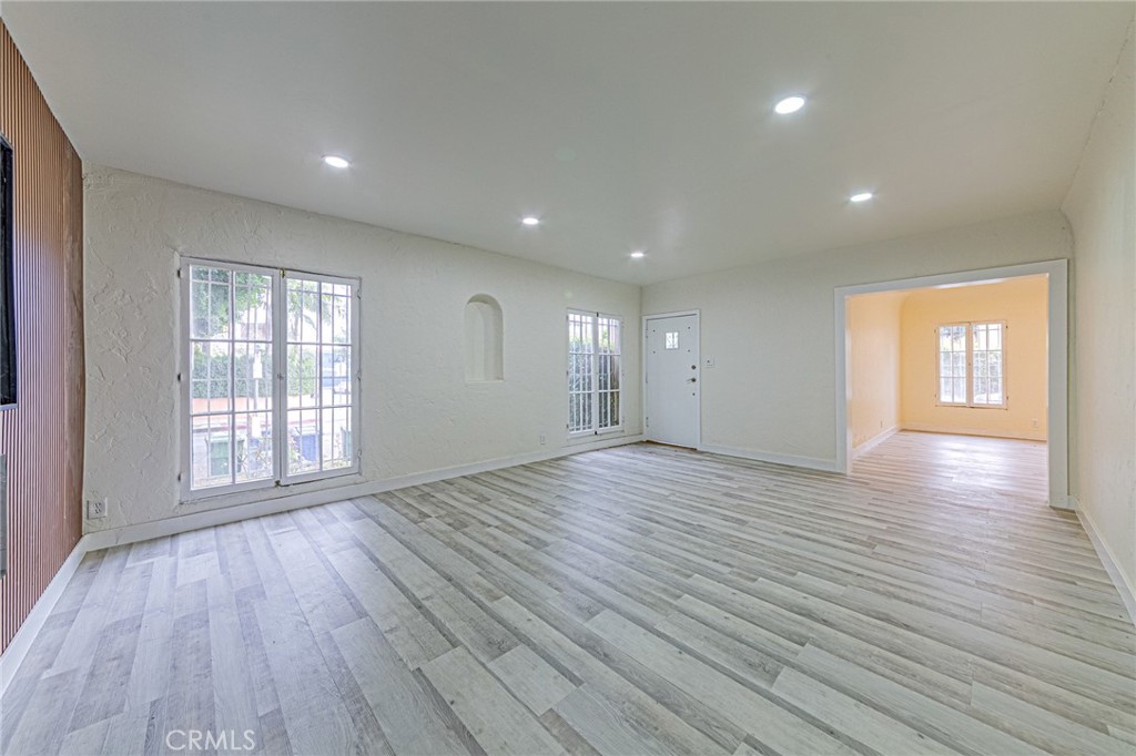 5355 West 8th Street Los Angeles, CA 90036 - Photo 28 of 32 a view of an empty room with wooden floor and a window