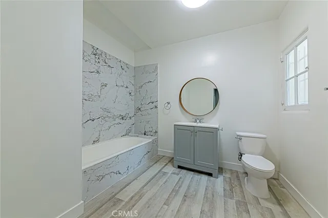 a view of room with wooden floor