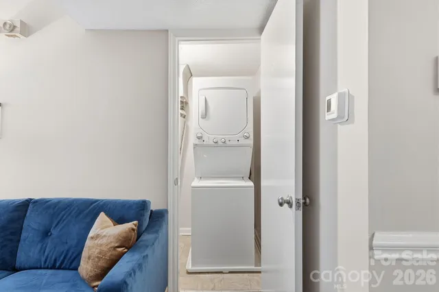 a living room with a couch and wooden floor