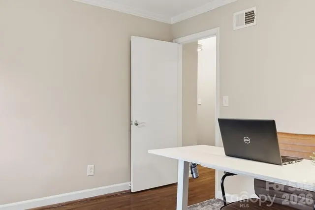 a view of a workspace with furniture