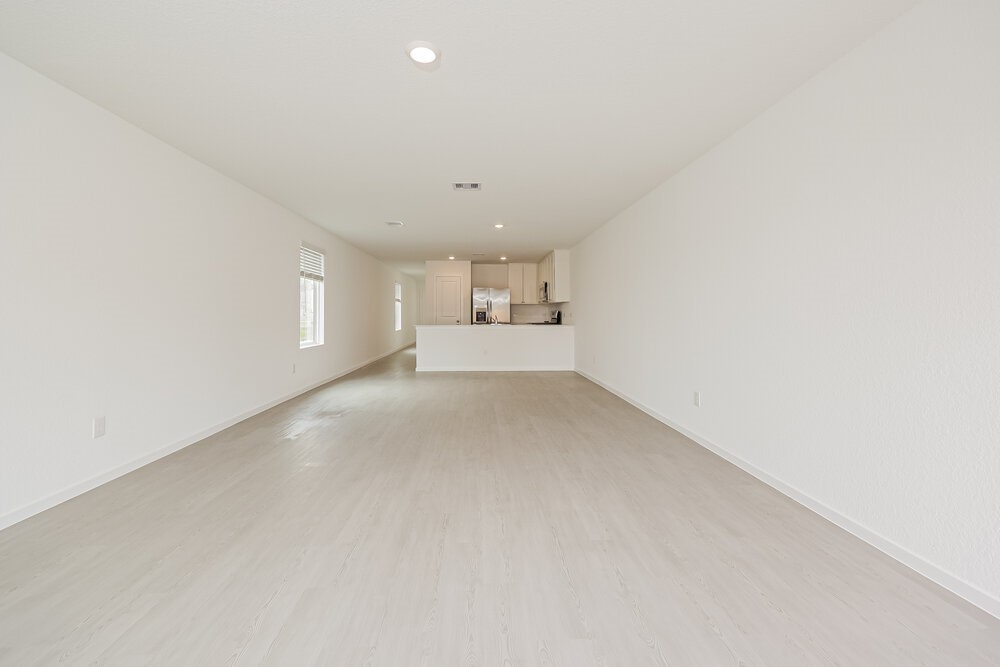 621 Craven Street Conroe, TX 77316 - Photo 3 of 16 a view of empty room with wooden floor