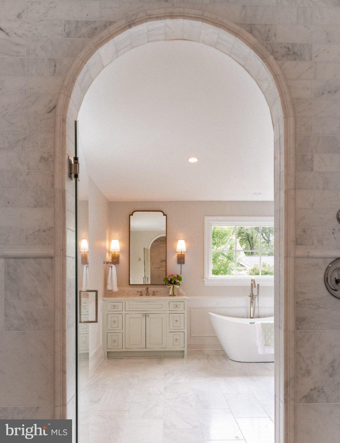 205 MacArthur Road Alexandria, VA 22305 - Photo 22 of 23 a bathroom with a double vanity sink a mirror and a bathtub