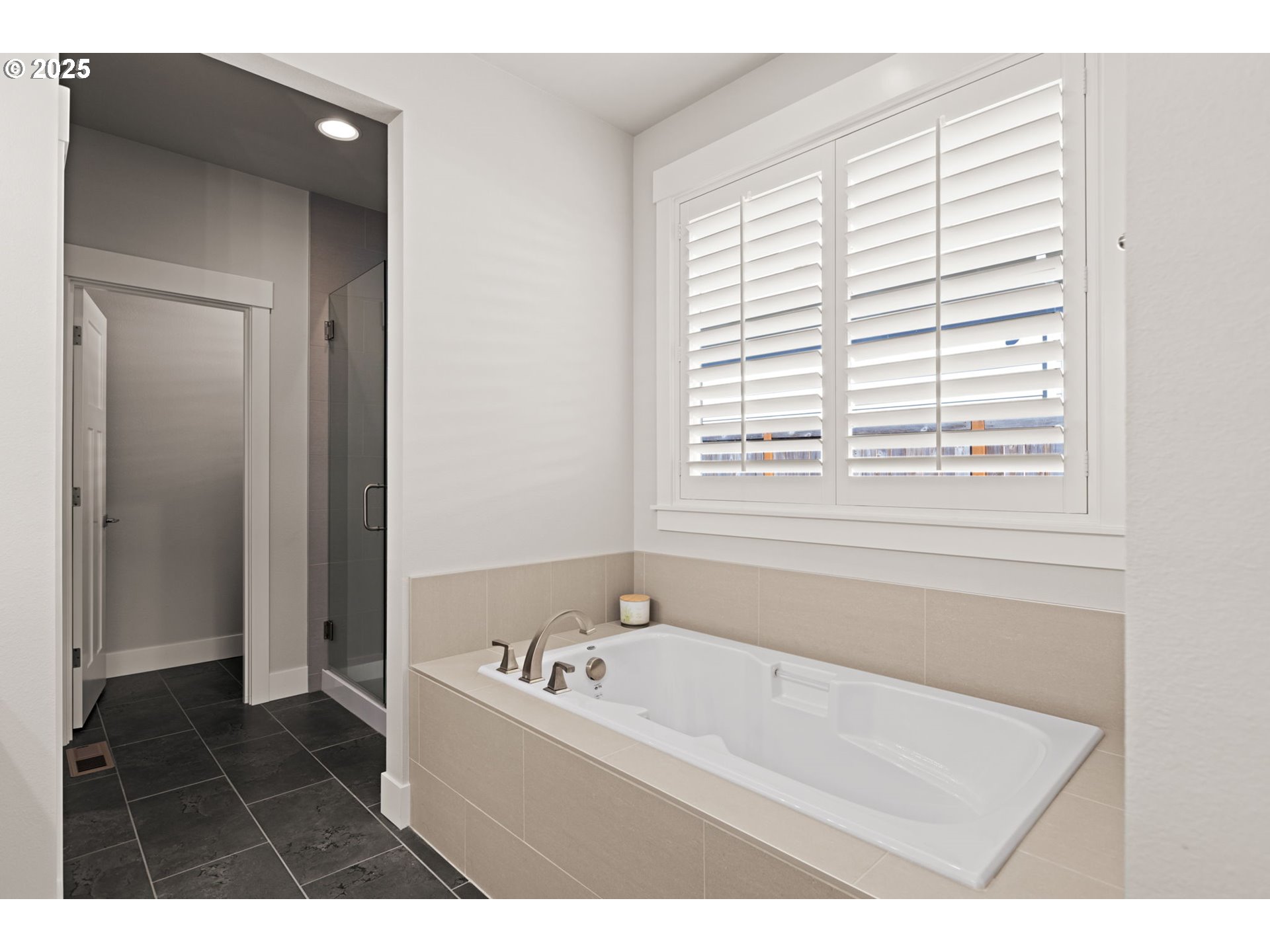 36904 Salmonberry Avenue Sandy, OR 97055 - Photo 16 of 44 a bathroom with a bathtub and a shower