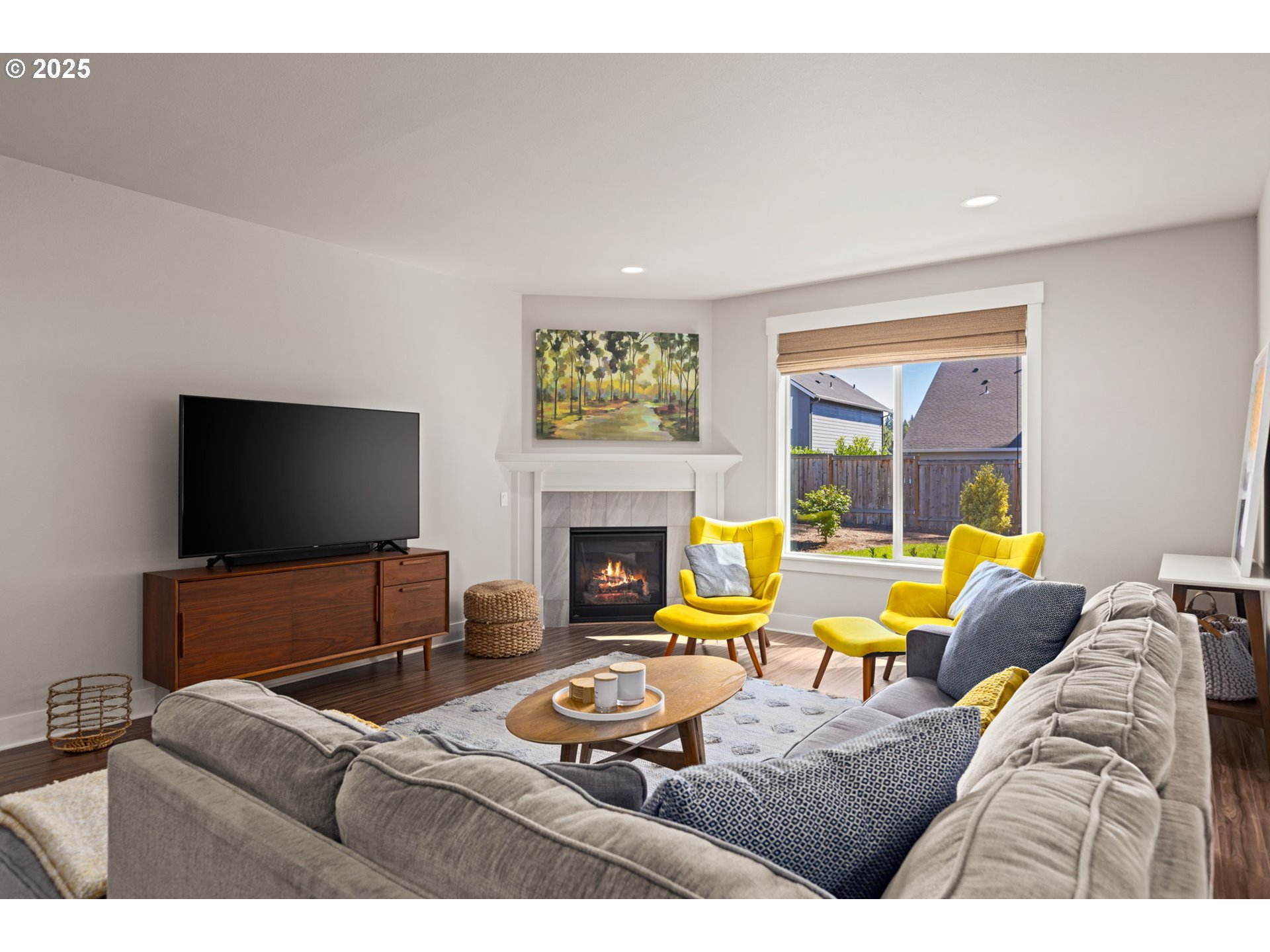 36904 Salmonberry Avenue Sandy, OR 97055 - Photo 2 of 44 a living room with furniture and a flat screen tv