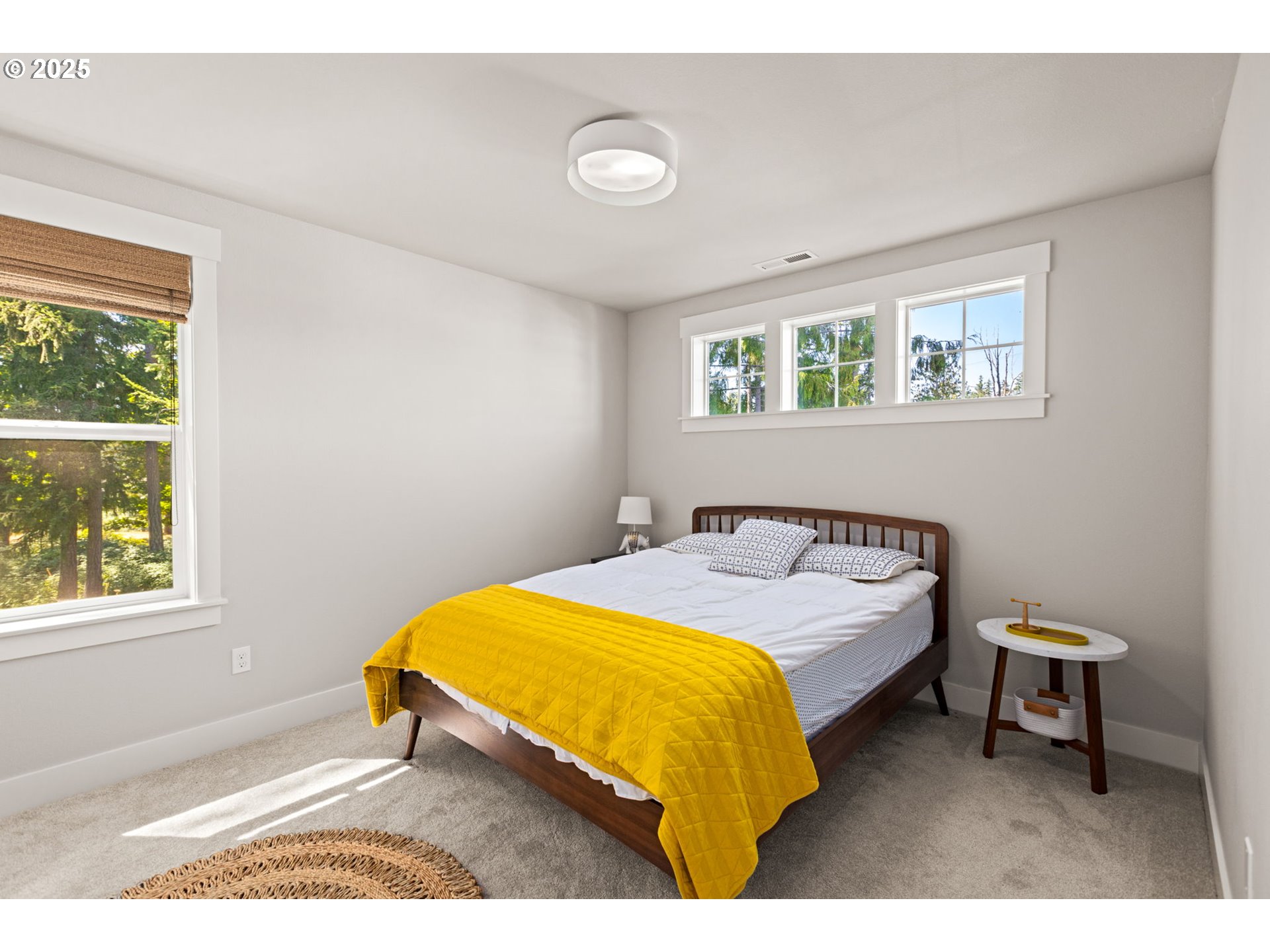 36904 Salmonberry Avenue Sandy, OR 97055 - Photo 23 of 44 a bed sitting in a bedroom next to a window
