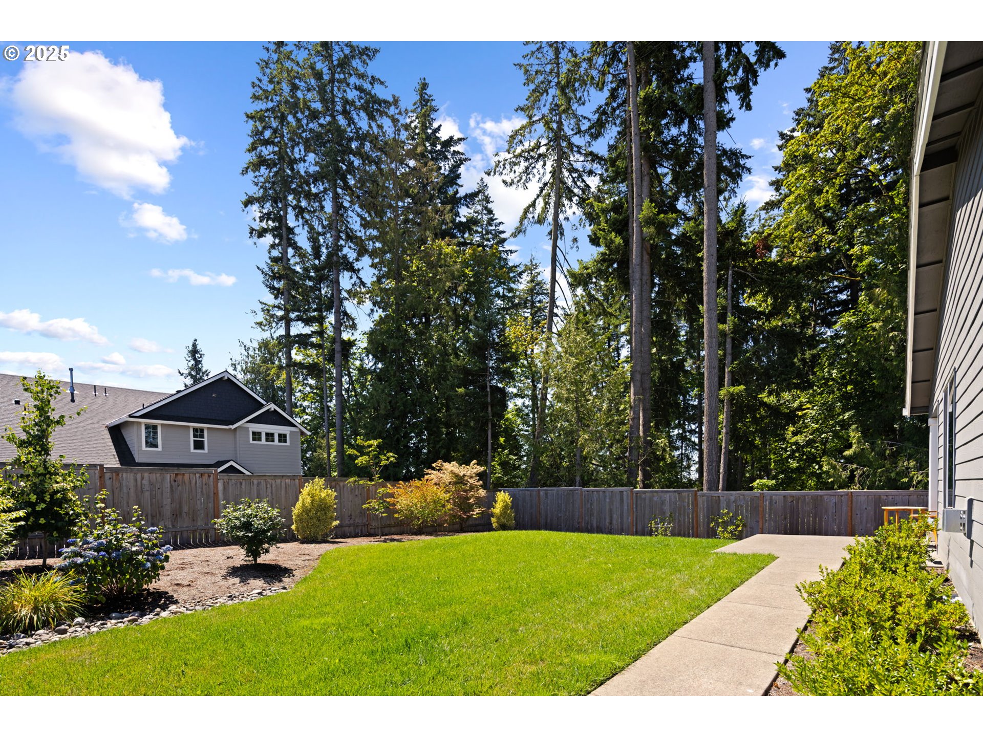 36904 Salmonberry Avenue Sandy, OR 97055 - Photo 29 of 44 a house view with a garden space