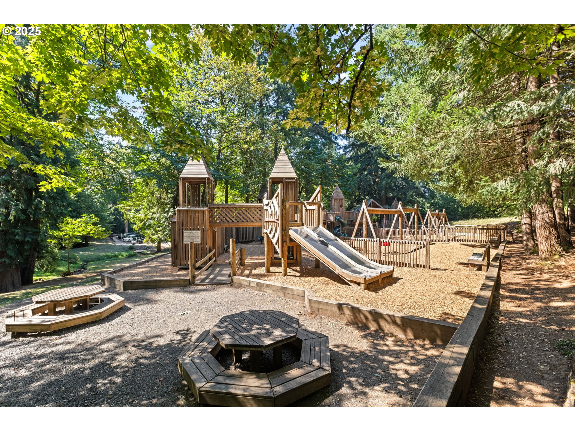 36904 Salmonberry Avenue Sandy, OR 97055 - Photo 41 of 44 a view of a patio with table and chairs with wooden fence
