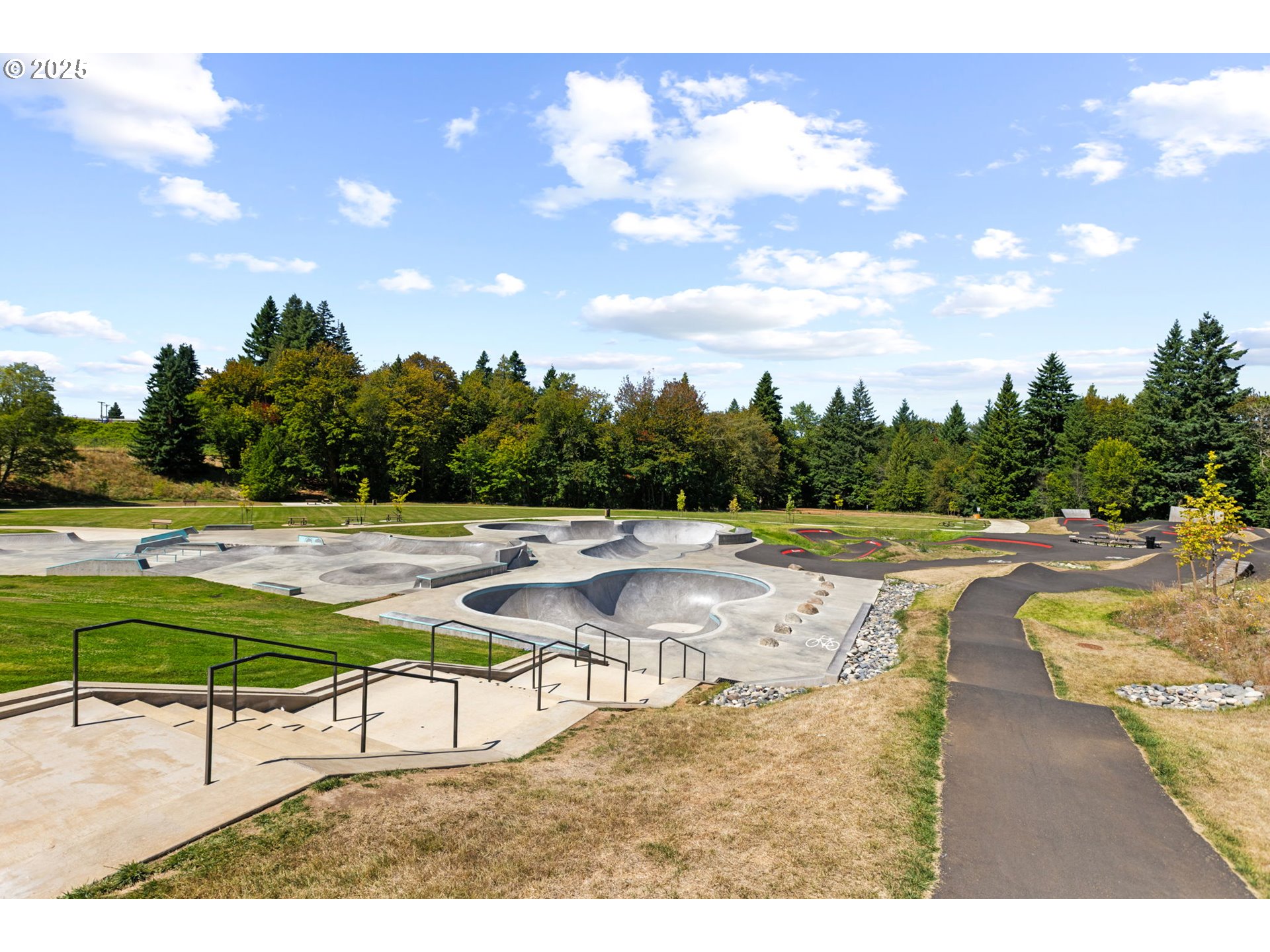 36904 Salmonberry Avenue Sandy, OR 97055 - Photo 42 of 44 a view of swimming pool with outdoor seating and trees in the background