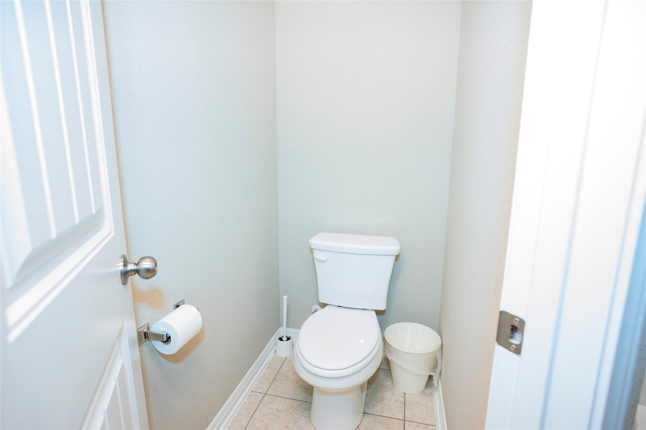 20916 Carries Ranch Road Pflugerville, TX 78660 - Photo 34 of 40 a white toilet sitting next to a shower curtain
