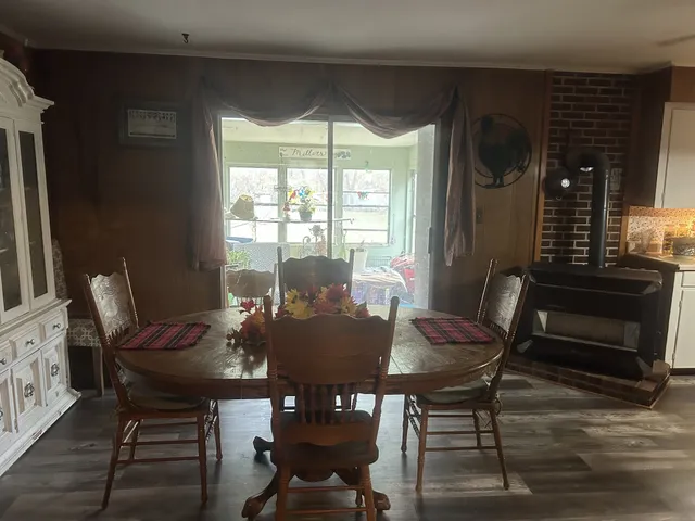 a view of a dining room with furniture and window
