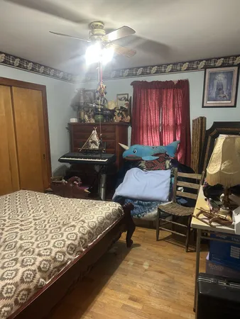 a bedroom with bed and window