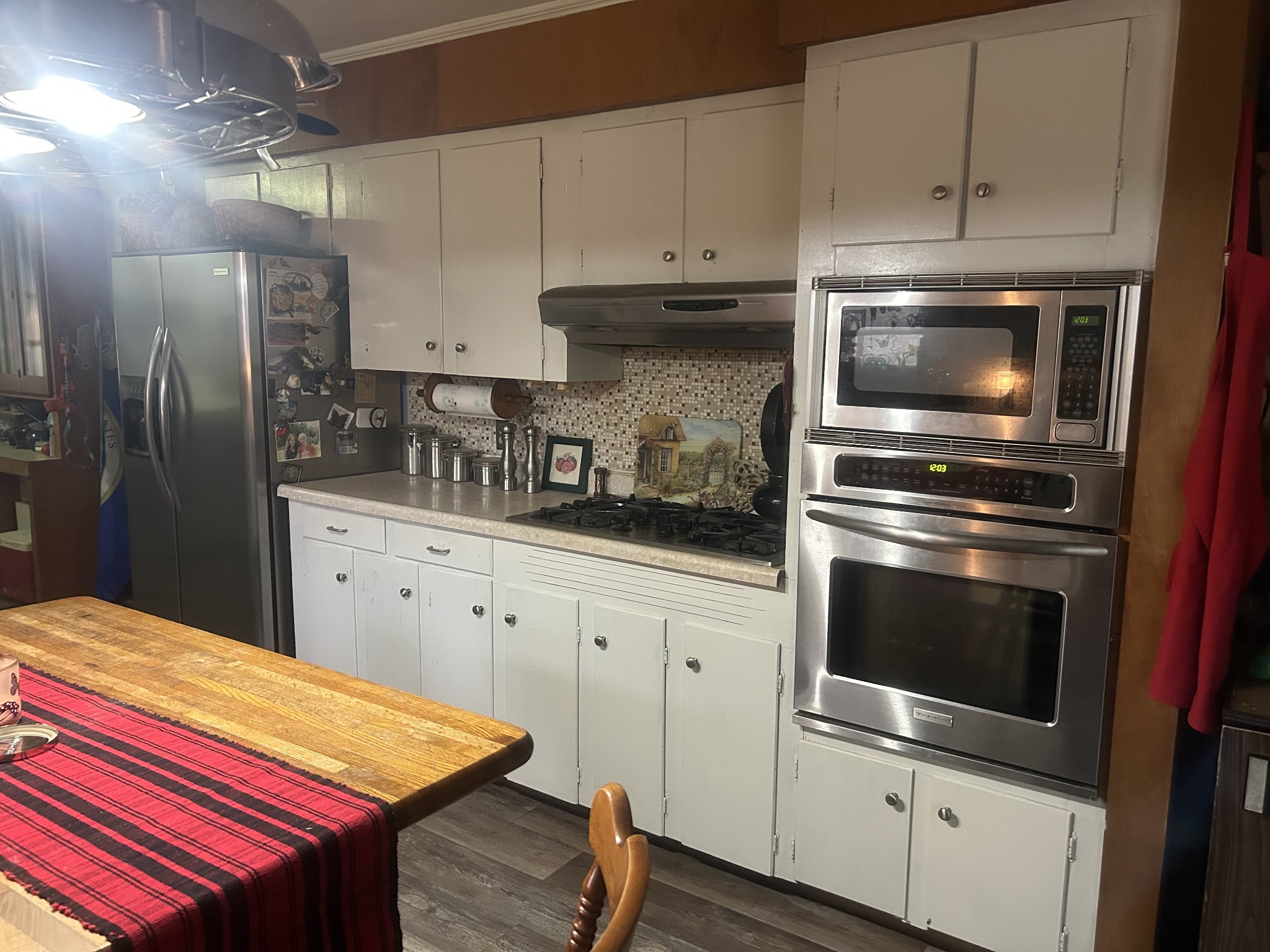 700 Corinth Road Sharon, TN 38255 - Photo 5 of 26 a kitchen with stainless steel appliances kitchen island granite countertop a stove a sink and a refrigerator