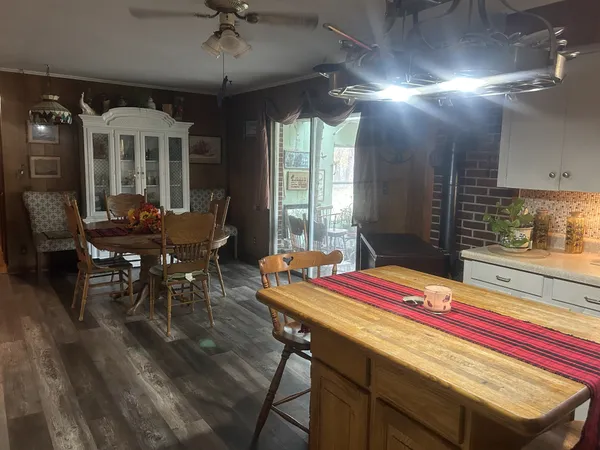 a room with musical instrument pool table and windows