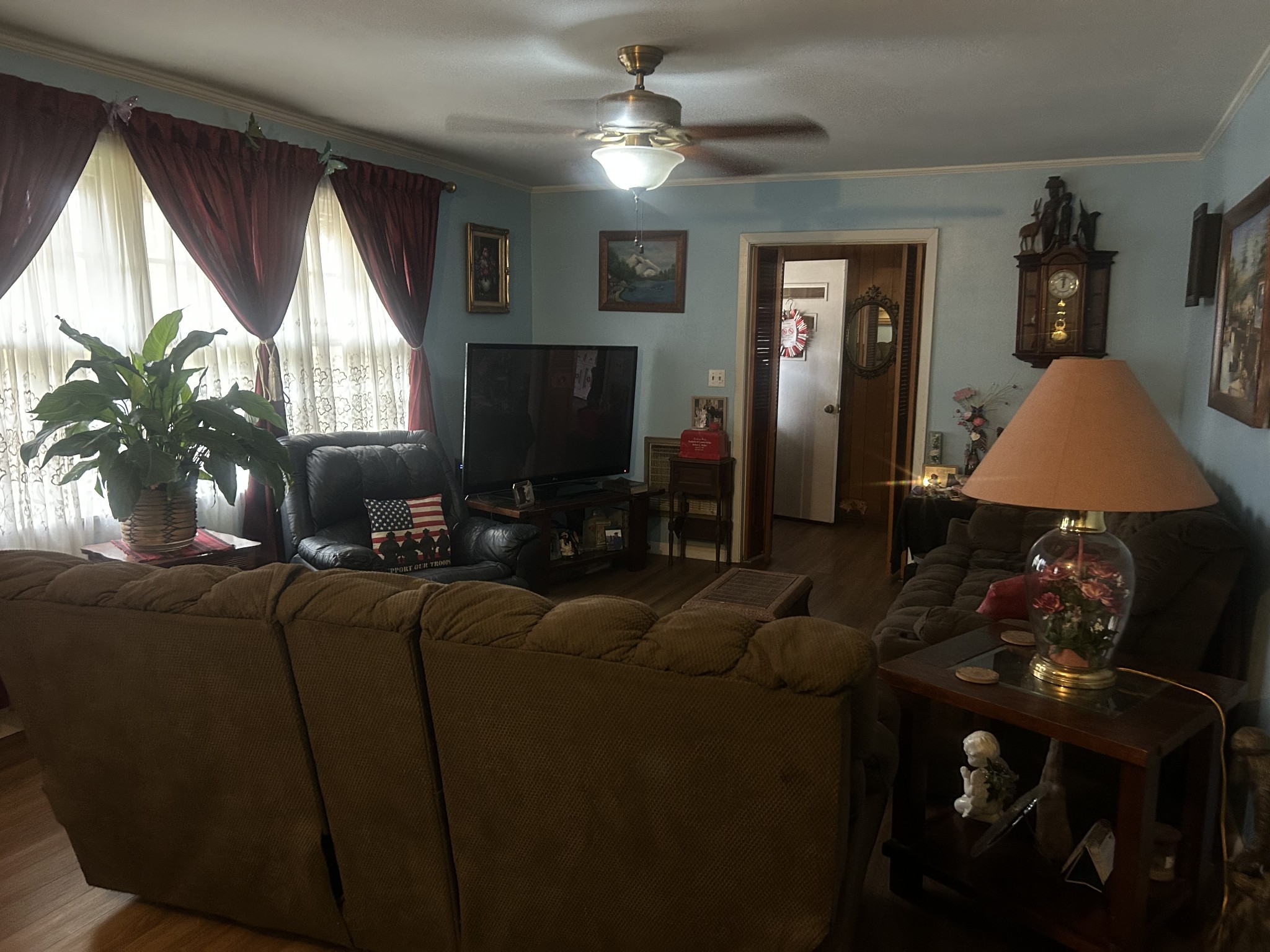 700 Corinth Road Sharon, TN 38255 - Photo 10 of 26 a living room with furniture a window and a flat screen tv