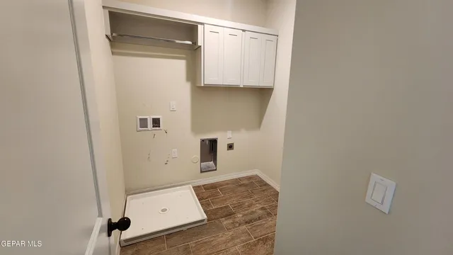 a view of an empty room and a bathroom