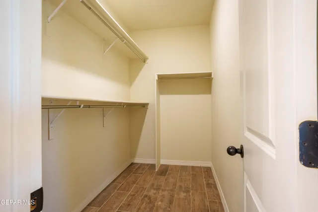 a view of a patio with table and chairs and potted plants