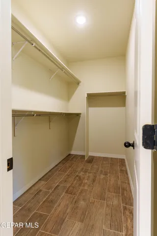 a view of a patio with table and chairs and potted plants
