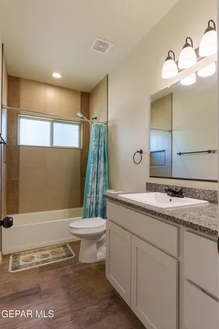 a view of a brick house with a small yard