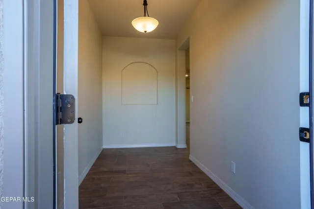 a view of a livingroom with a kitchen