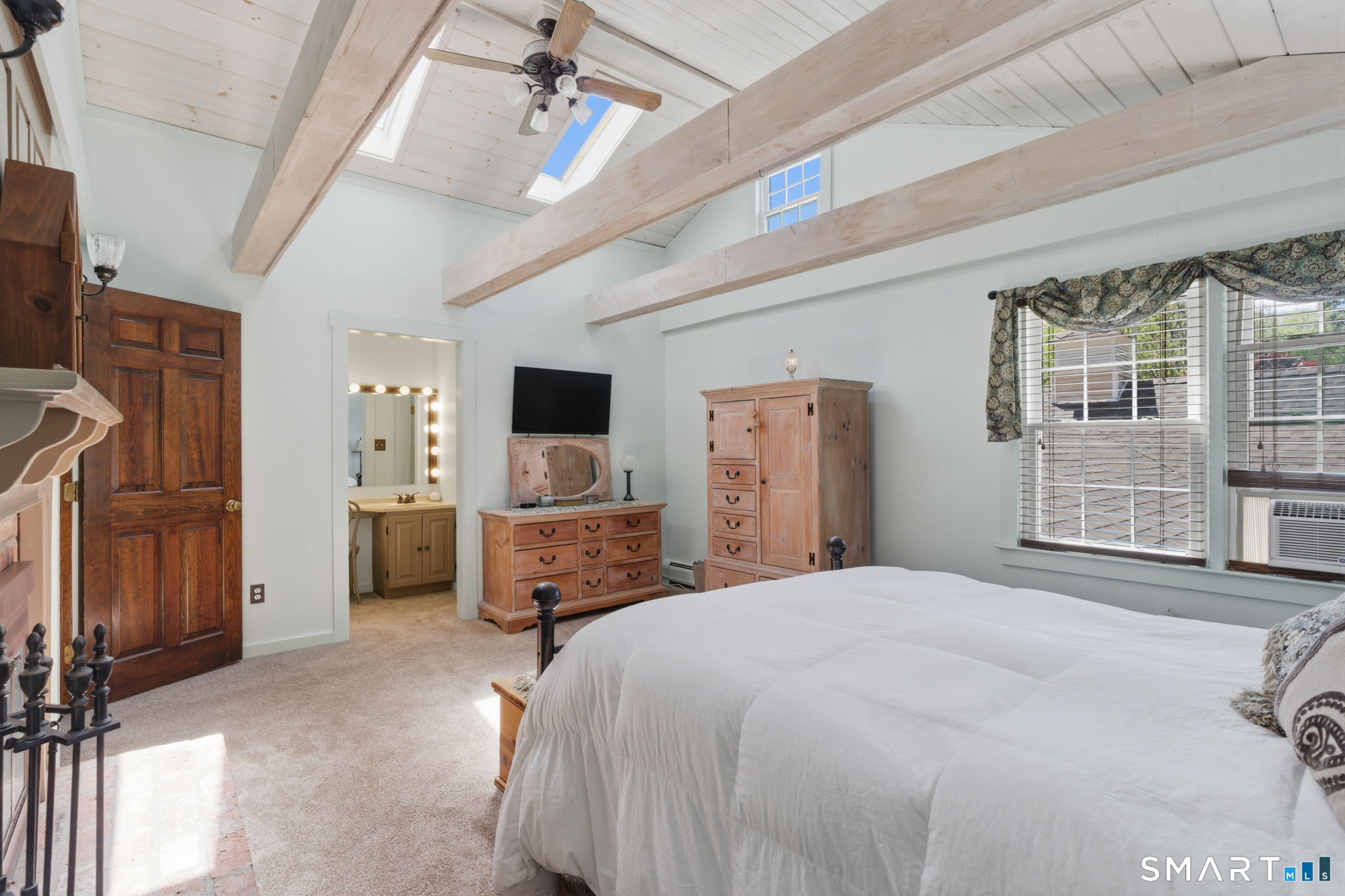 79 Buckboard Lane Bristol, CT 06010 - Photo 32 of 40 a bedroom with a bed flat screen tv and a large window