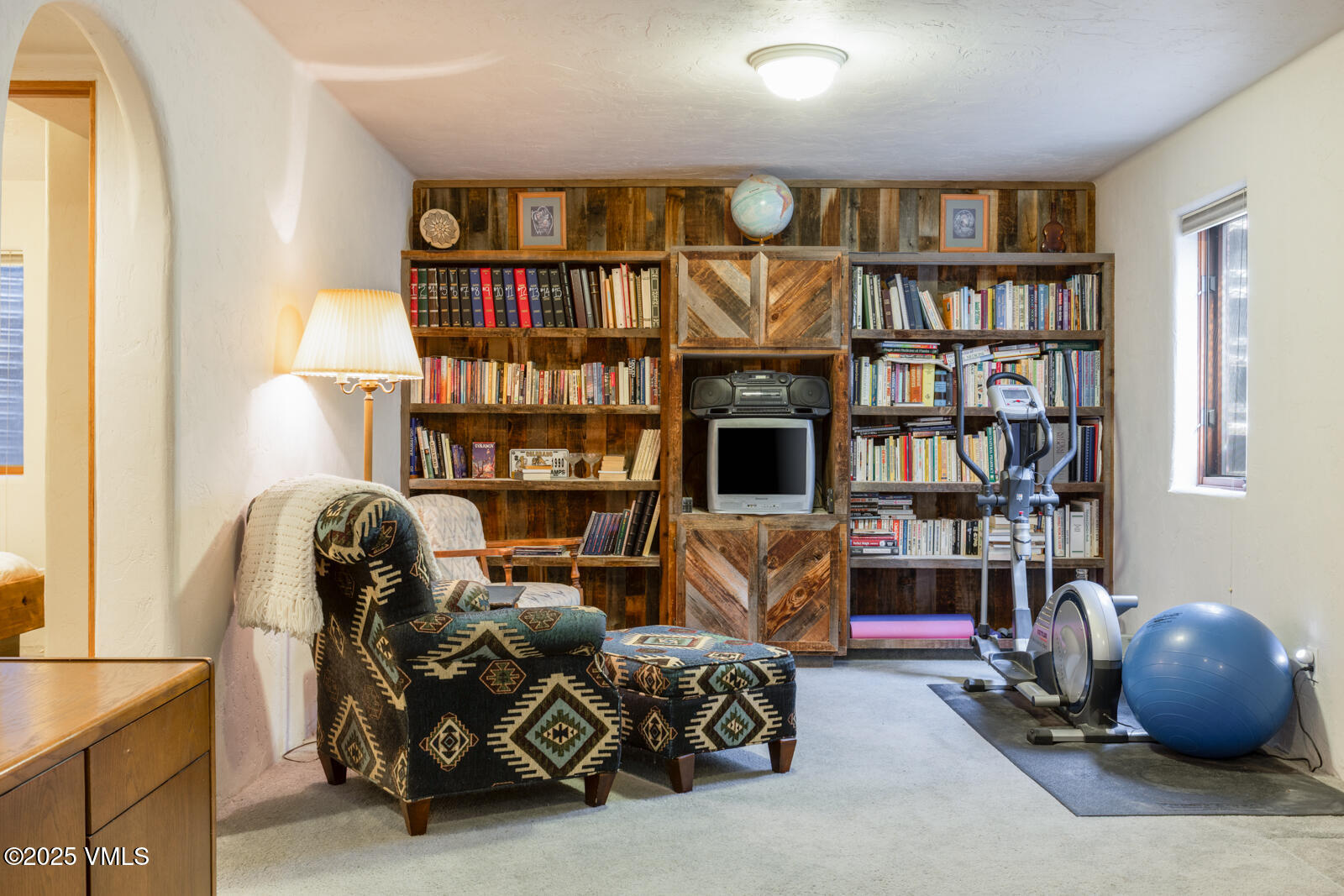20 Hereford Road Edwards, CO 81632 - Photo 27 of 32 a living room with furniture a book shelf and a book shelf