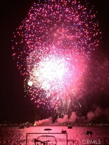 a view of a house with wooden stairs and stairs