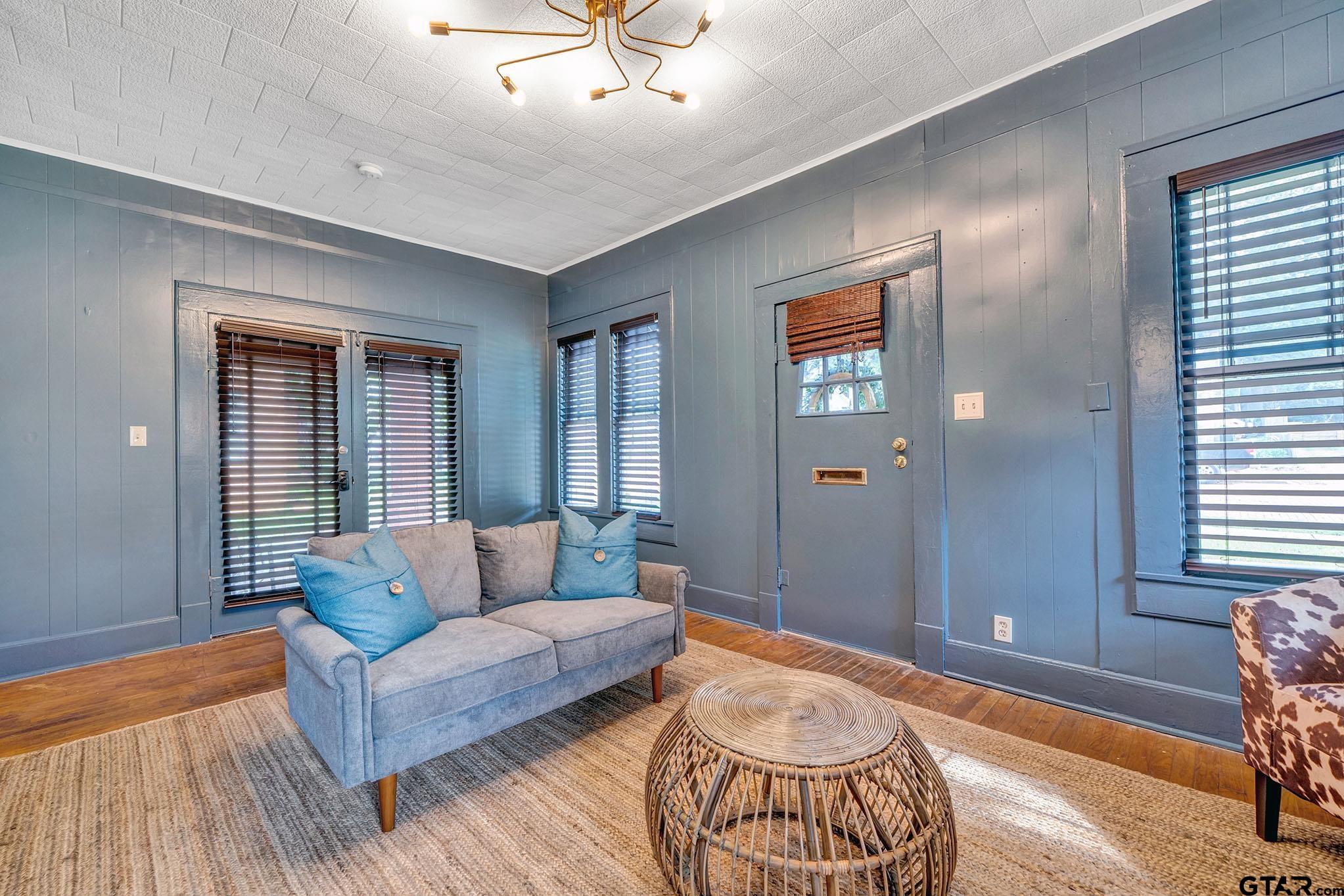 301 West Houston Street Tyler, TX 75702 - Photo 12 of 18 a living room with furniture and a window