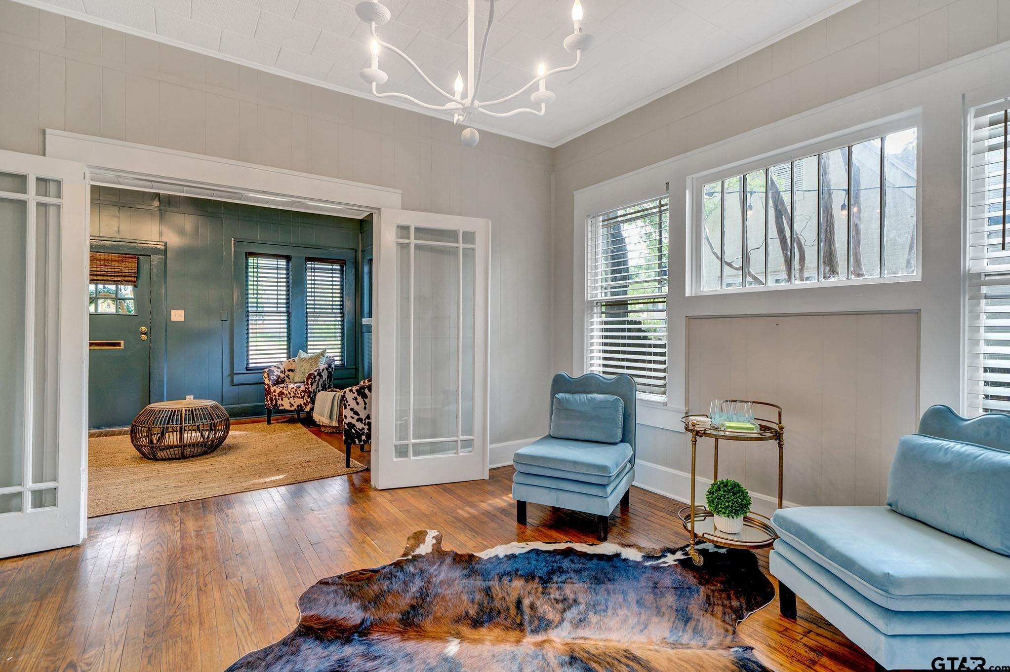 301 West Houston Street Tyler, TX 75702 - Photo 10 of 18 a living room with furniture and a large window
