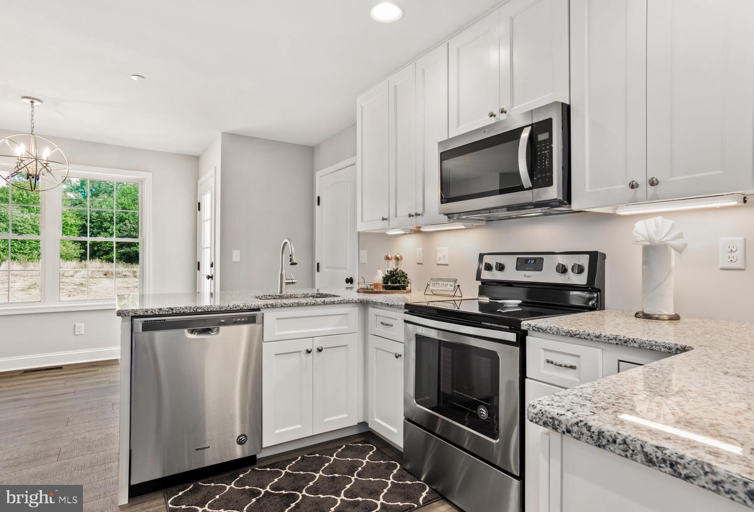11007 Fair Lane Ridgely, MD 21660 - Photo 12 of 37 Sleek White Kitchen w/granite counter tops