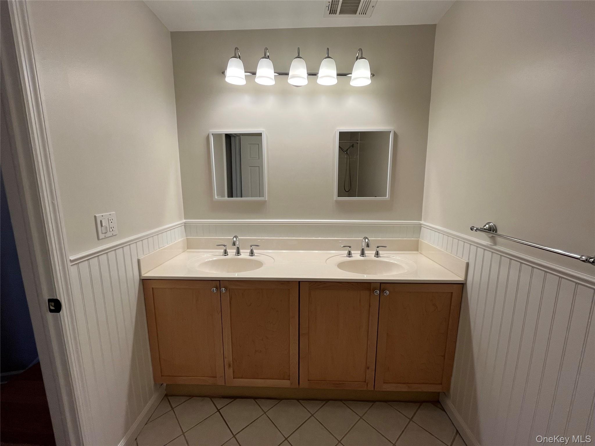11 Wildwood Road, Unit 12 Katonah, NY 10536 - Photo 14 of 17 a bathroom with a sink and a mirror