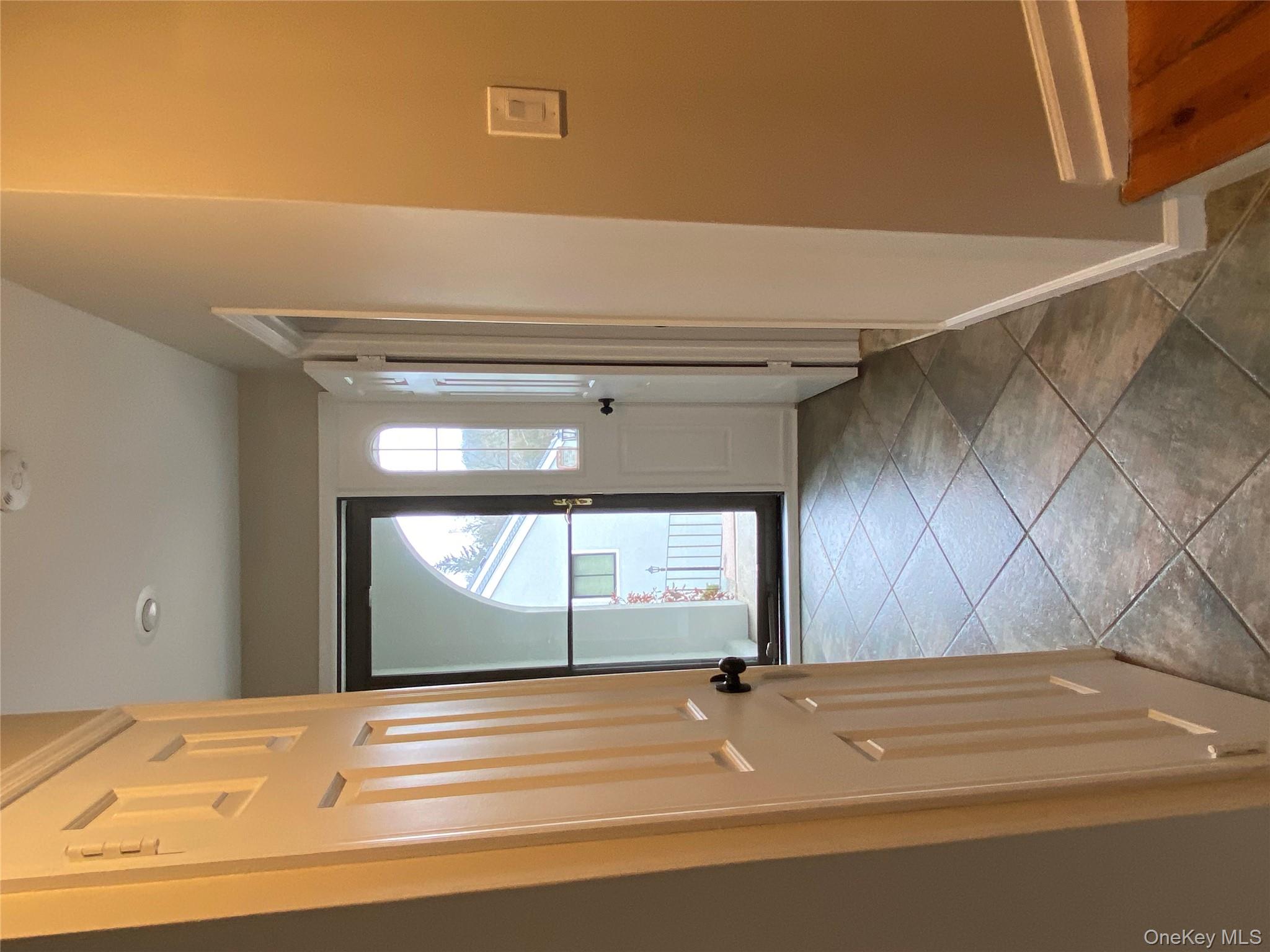11 Wildwood Road, Unit 12 Katonah, NY 10536 - Photo 2 of 17 a view of a hallway with wooden floor and cabinet