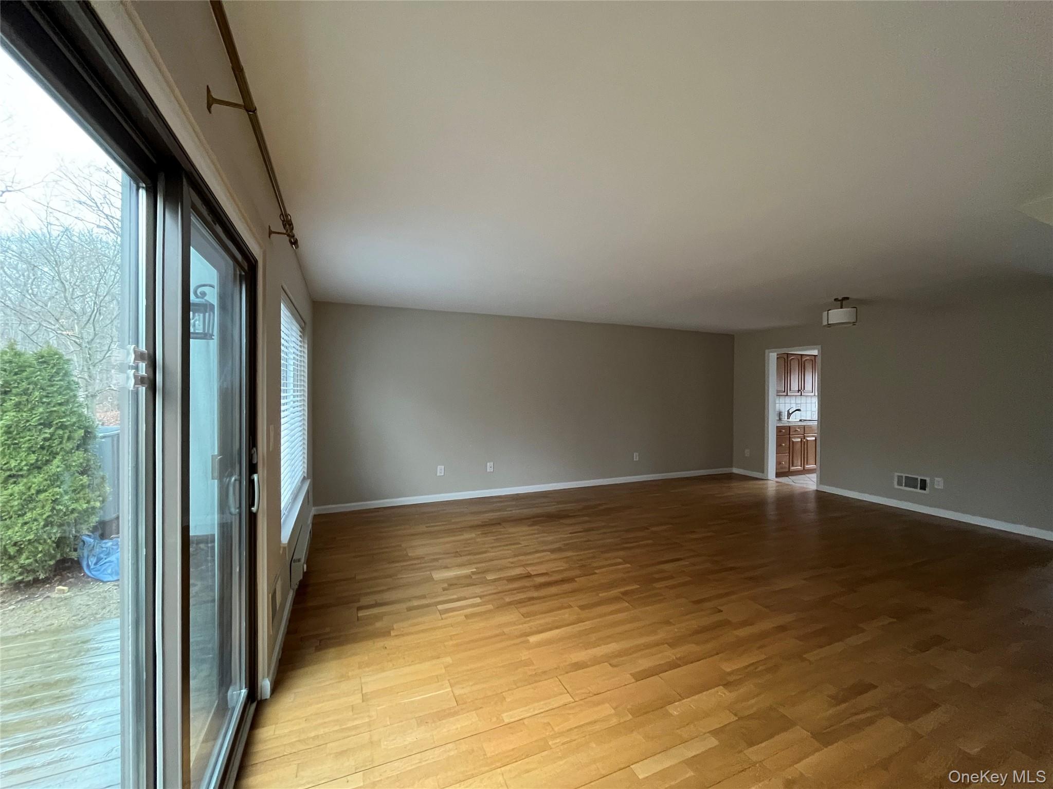11 Wildwood Road, Unit 12 Katonah, NY 10536 - Photo 4 of 17 a view of an empty room and window