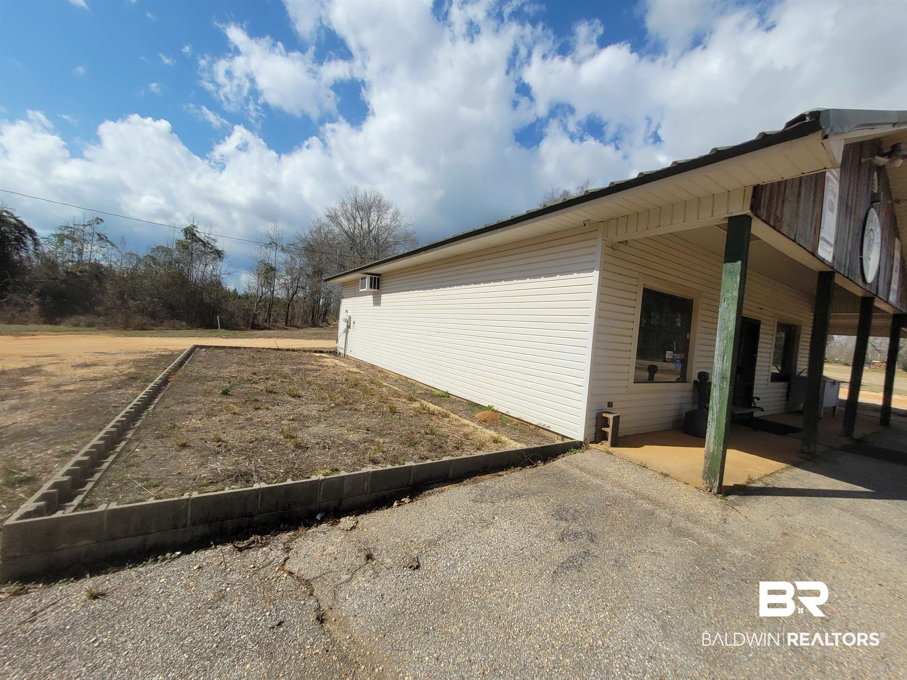 2777 Highway 83 Evergreen, AL 36401 - Photo 7 of 14 View of property exterior with a patio area