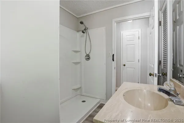 a kitchen with granite countertop a sink and a stove