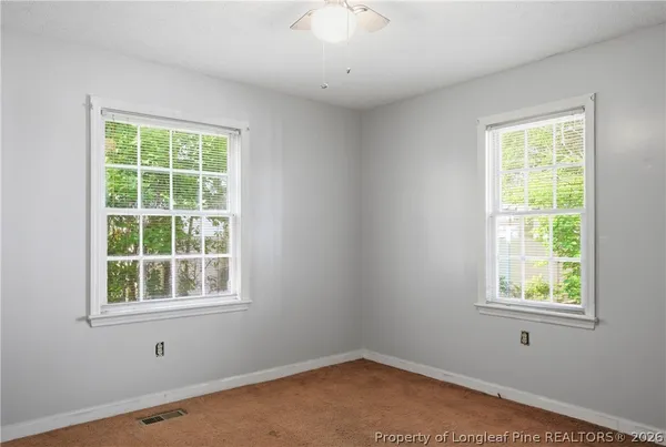 a view of a house with a tree s