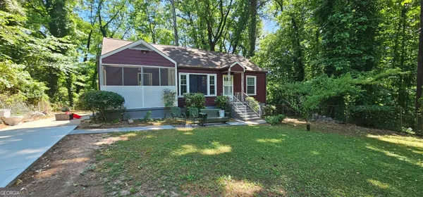 a front view of a house with a yard table and chairs