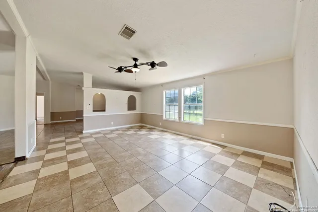 a view of an empty room with a window