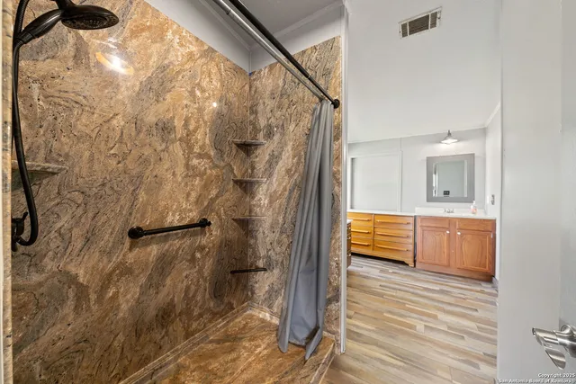 a bathroom with a bathtub and a shower