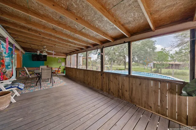 a view of a patio with wooden floor