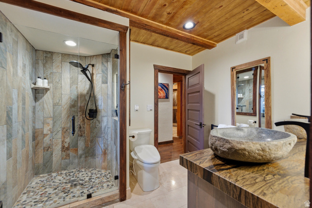 2687 Stewart Road Sundance, UT 84604 - Photo 34 of 48 Bathroom with a stall shower, recessed lighting, vanity, light tile patterned floors, and wooden ceiling