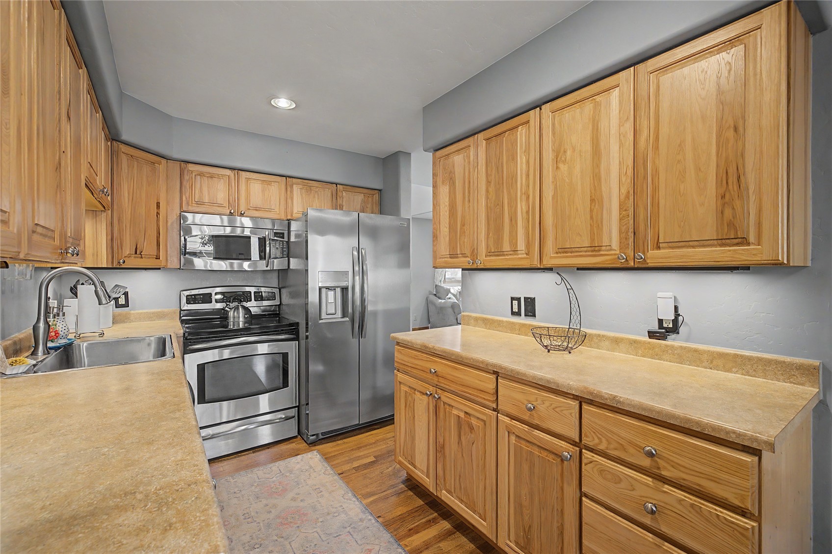 6726 Ryan Gulch Road, Unit 6726 Wildernest, CO 80498 - Photo 9 of 39 a kitchen with stainless steel appliances granite countertop a refrigerator sink and stove