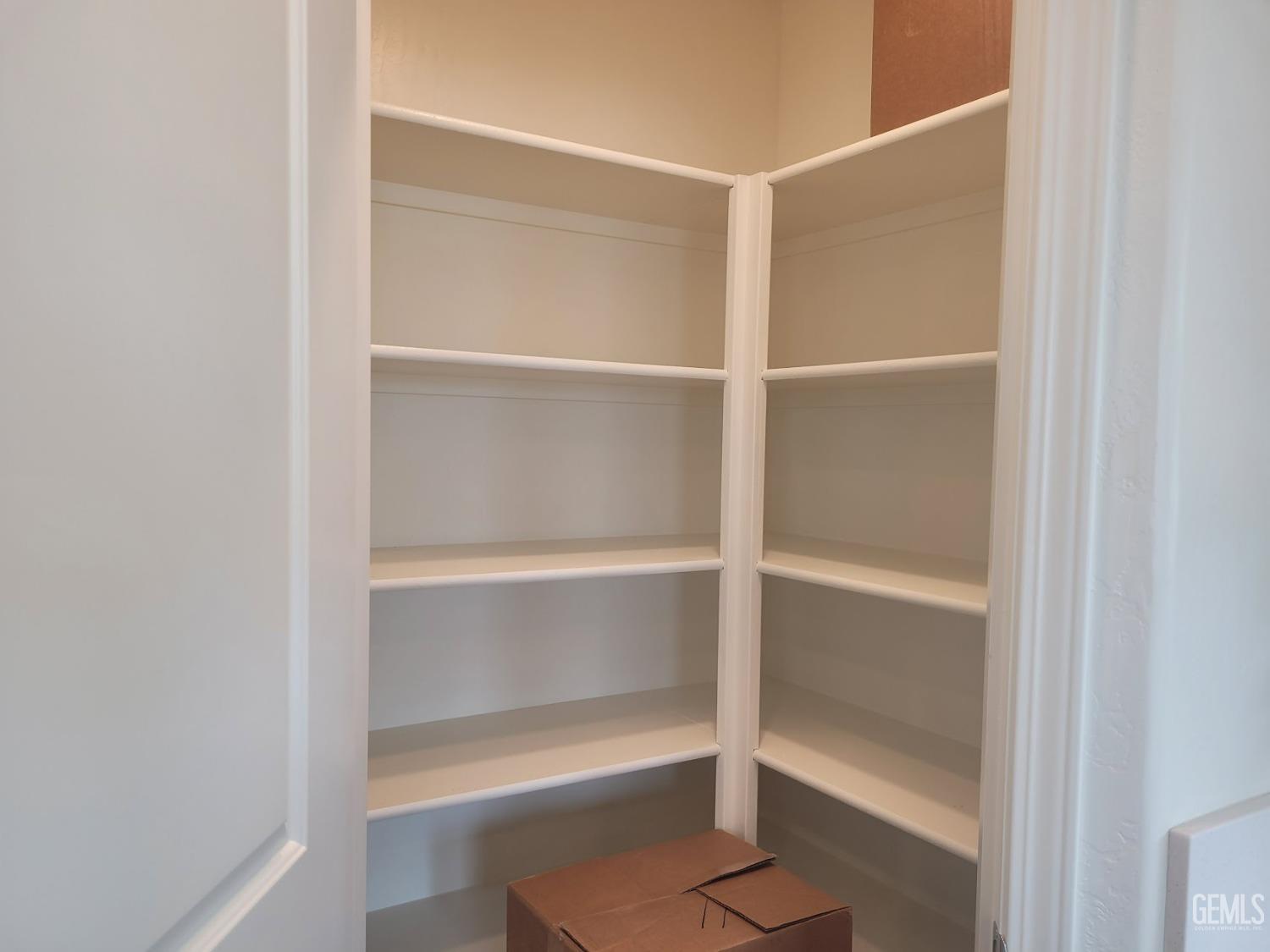 Undisclosed Address Bakersfield, CA 93313 - Photo 13 of 24 a room with walk in closet with empty racks