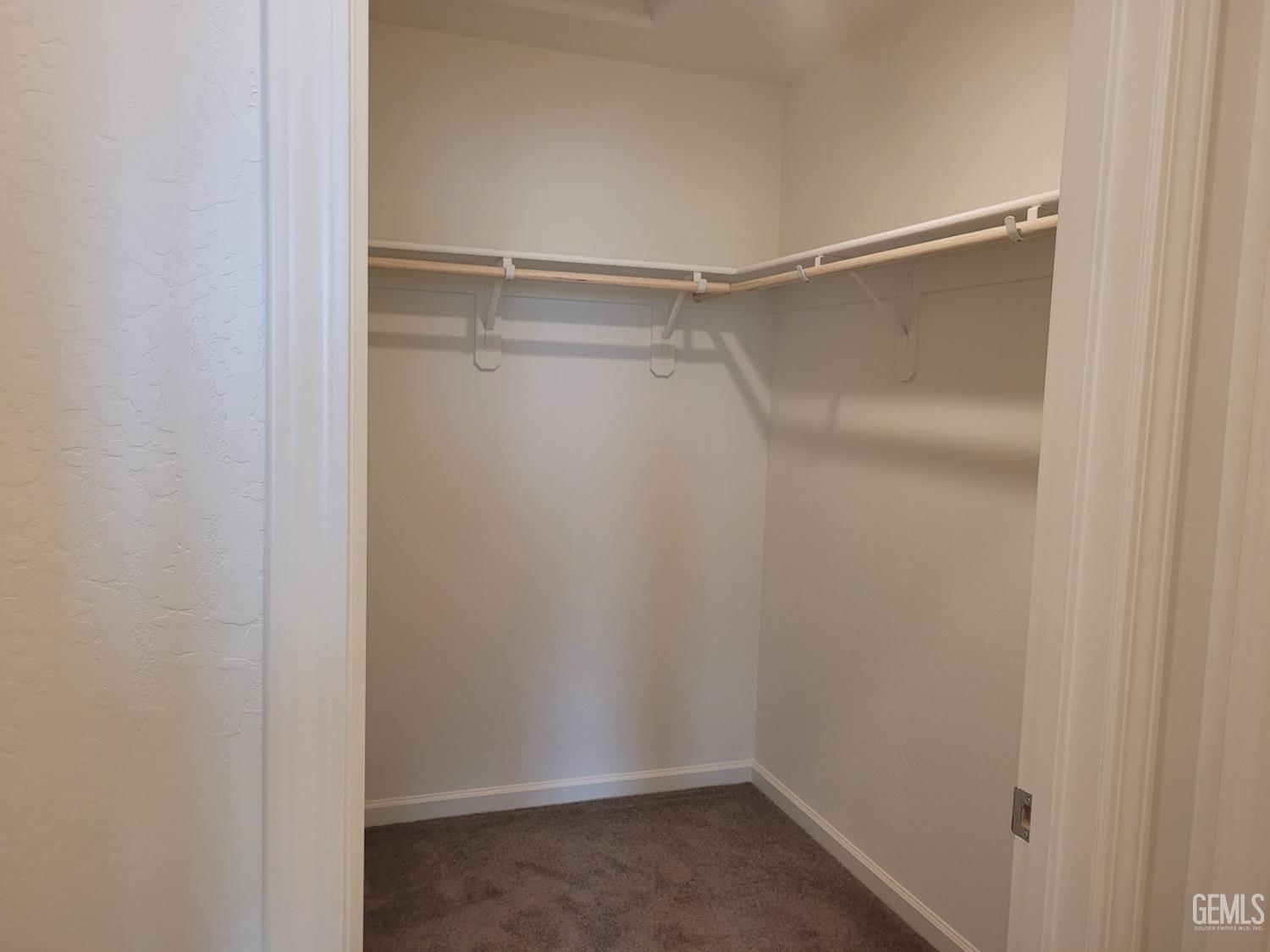 Undisclosed Address Bakersfield, CA 93313 - Photo 21 of 24 a view of an empty walk in closet