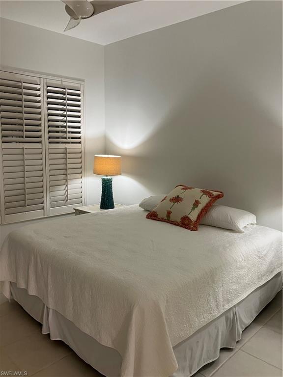 4080 Trinidad Way Naples, FL 34119 - Photo 12 of 15 a bedroom with a bed and a window