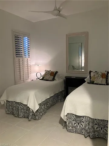 a bedroom with bed and window