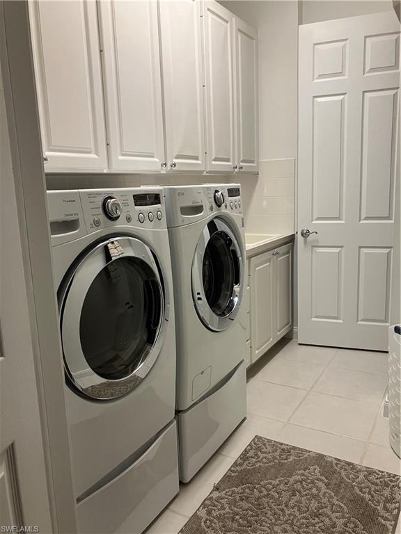 4080 Trinidad Way Naples, FL 34119 - Photo 15 of 15 a utility room with dryer and washer