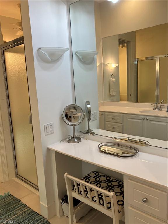 4080 Trinidad Way Naples, FL 34119 - Photo 10 of 15 a bathroom with a sink and a mirror