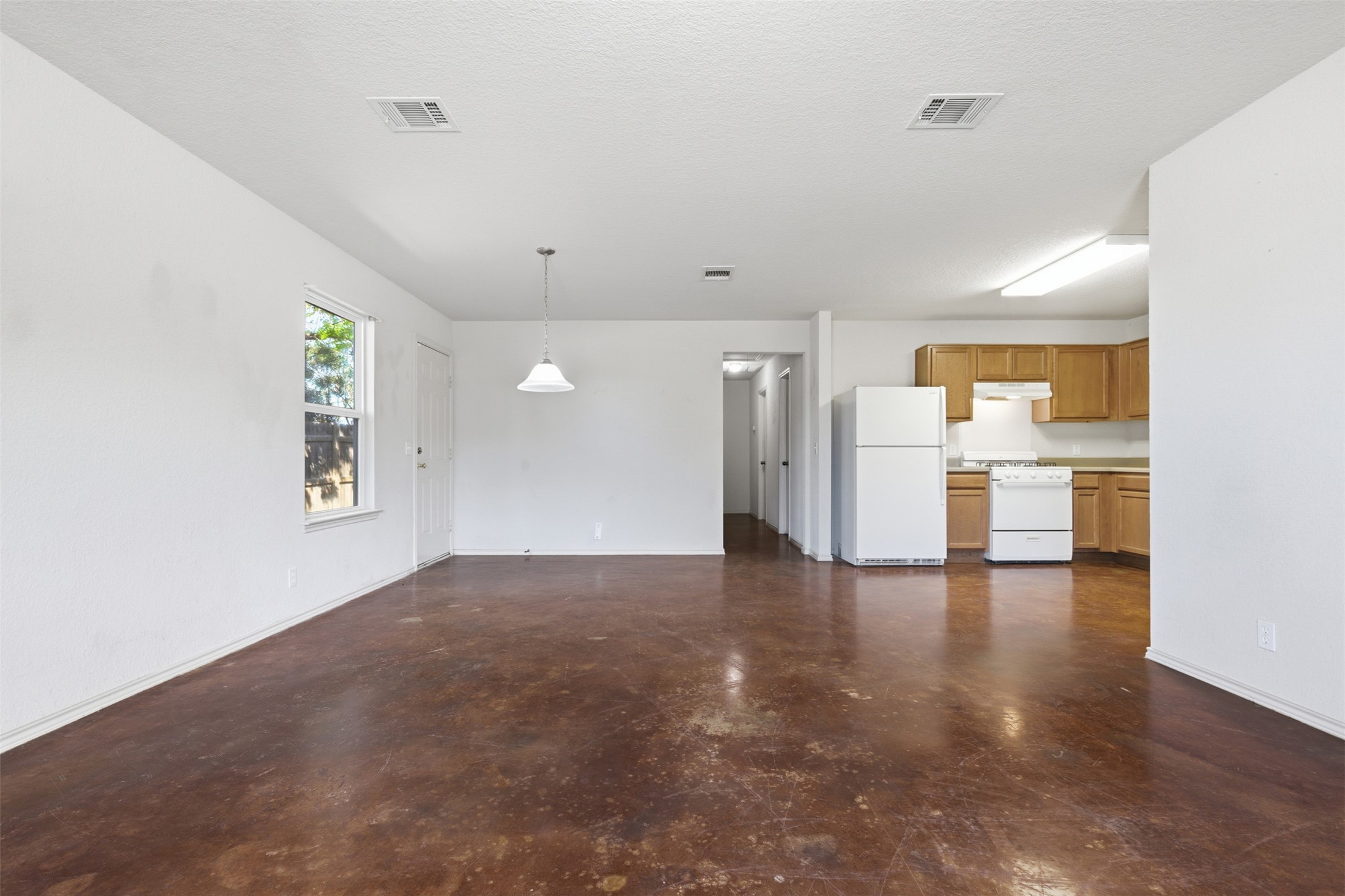 4529 Secure Lane, Unit 31 Austin, TX 78725 - Photo 8 of 38 a view of empty room with wooden floor and windows