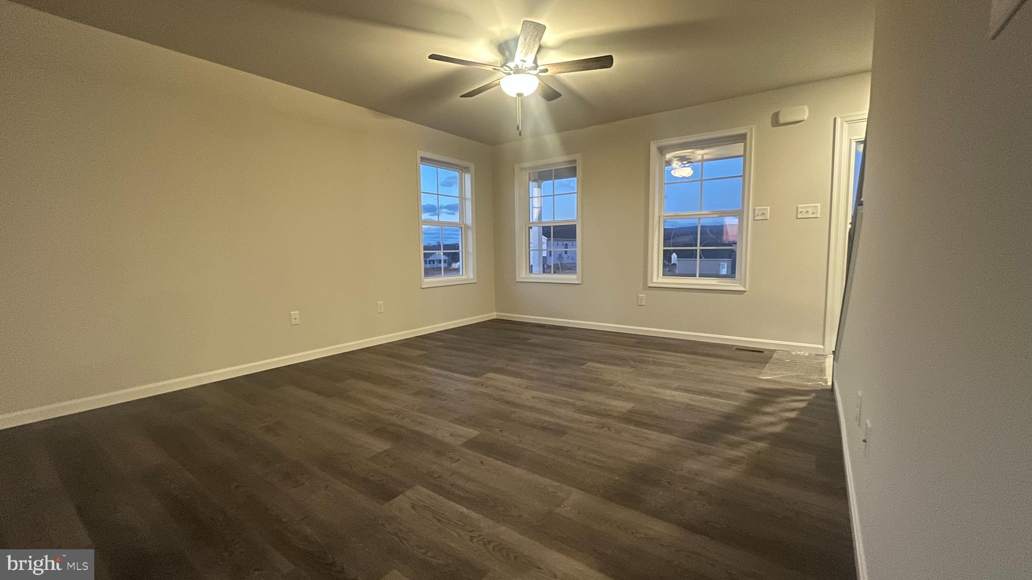 10030 Pendleton Avenue Waynesboro, PA 17268 - Photo 11 of 36 en empty room with windows and ceiling fan